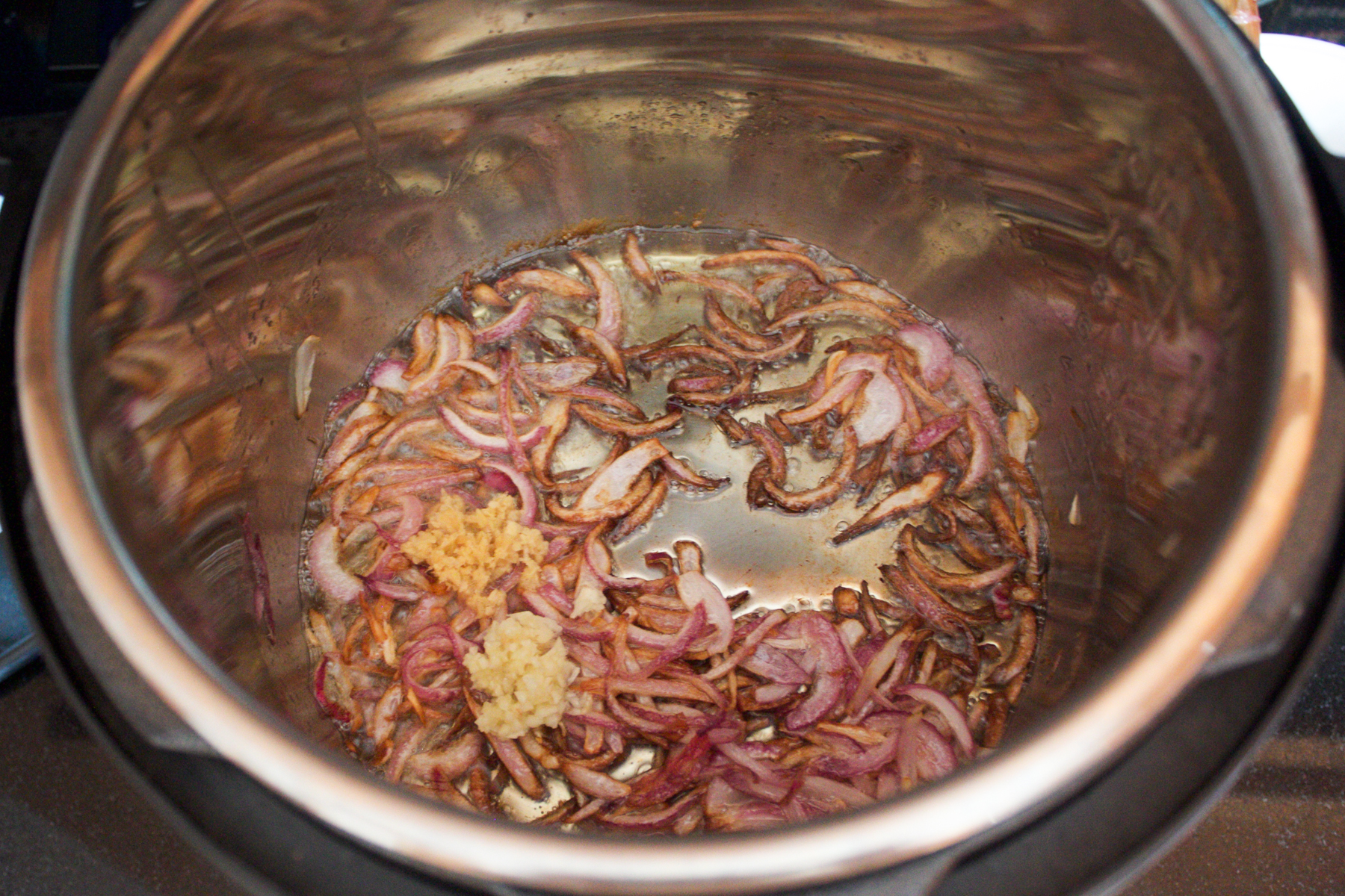 fried onions with crushed ginger and garlic