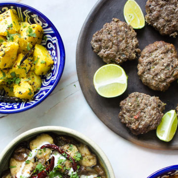 ground beef kebabs with gujarati style potatoes, and eggplant