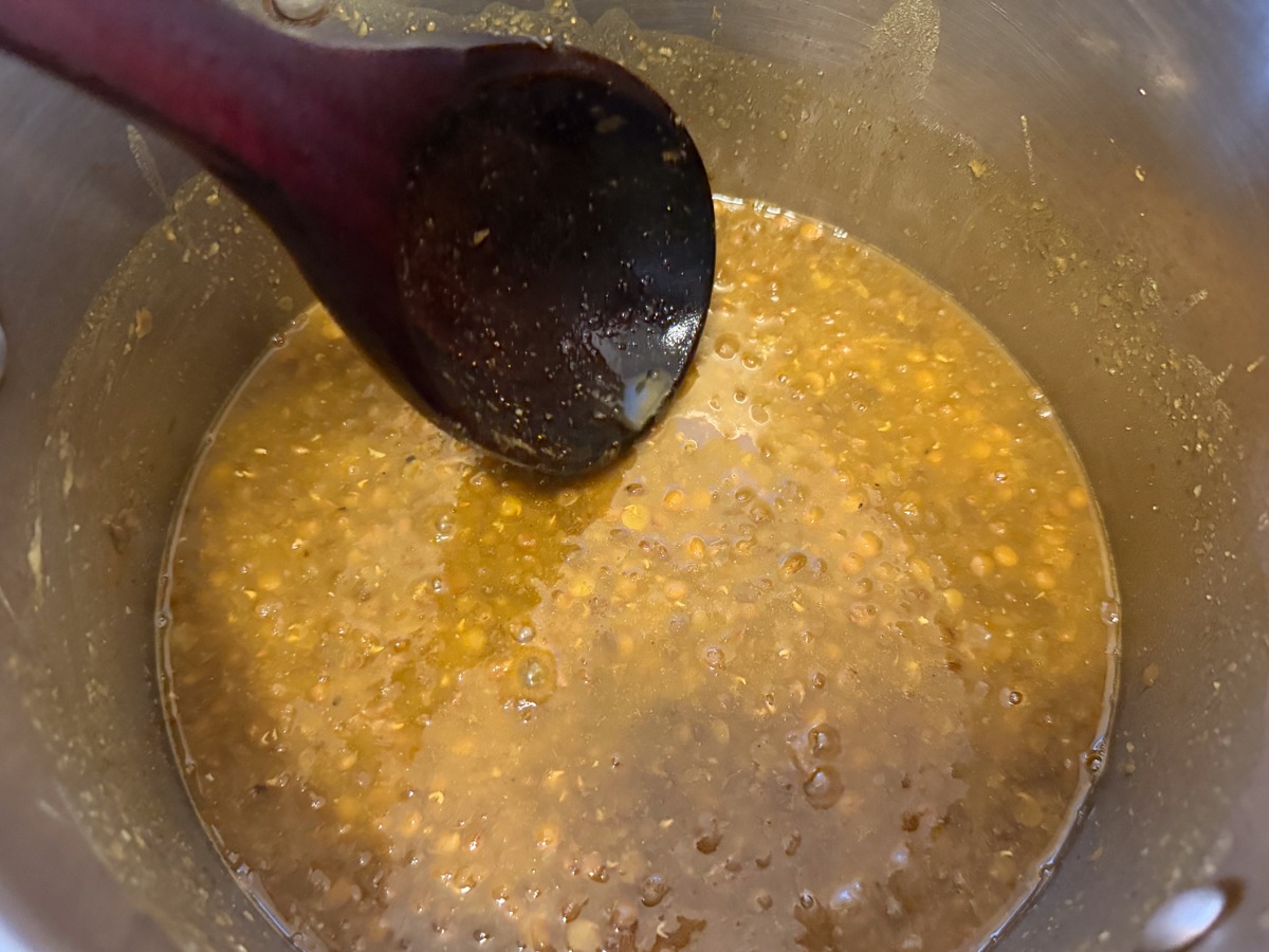 mash the kali dal with a wooden spoon against saucepan