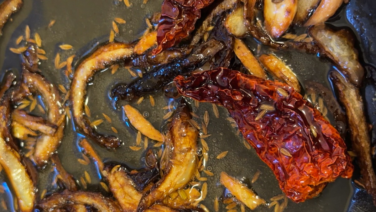 tadka of onion, cumin seeds, garlic and dried red chile 