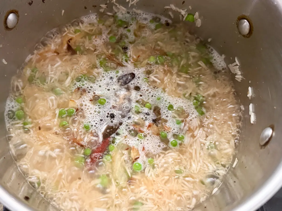 Add water to pulao, and bring to boil. 