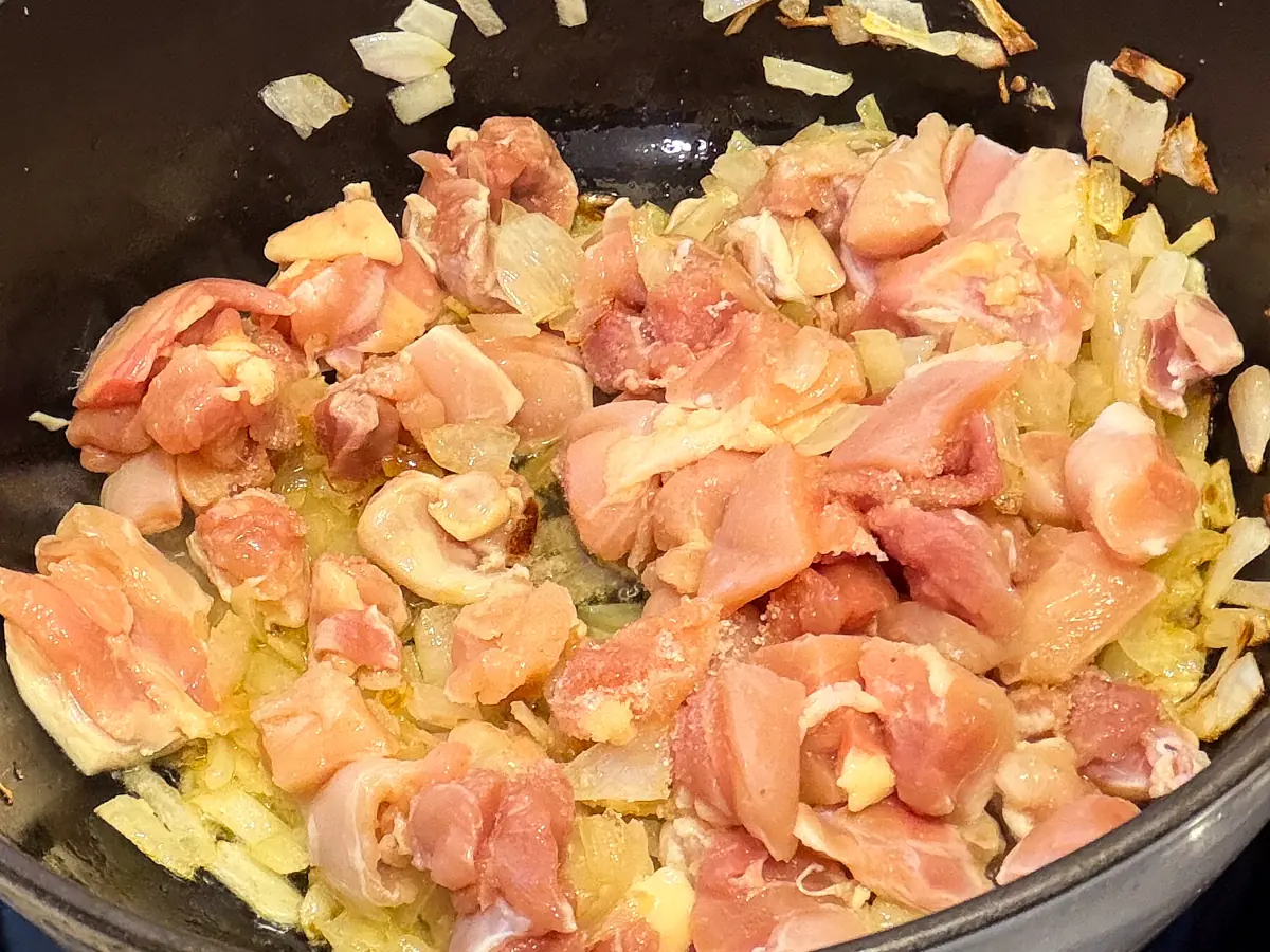 Chopped chicken added to browned onions