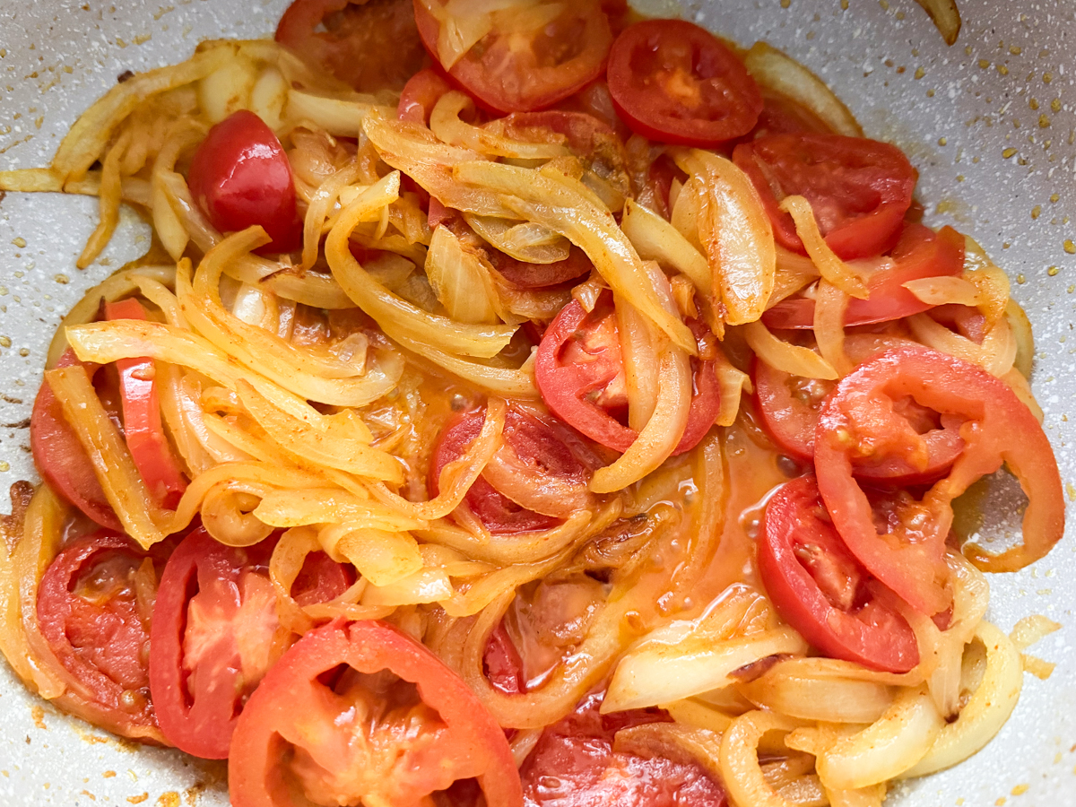 softened tomatoes with turmeric, red chili powder and salt 
